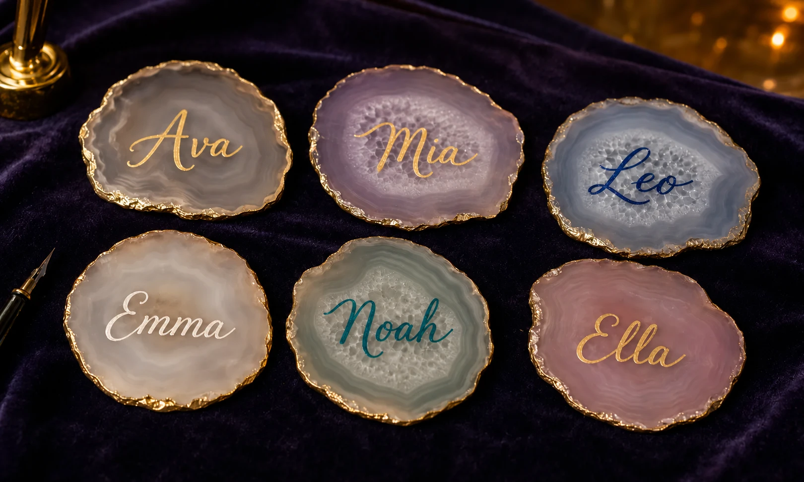 Gold-edged agate keepsakes with names in gold, ivory, navy and teal marker calligraphy