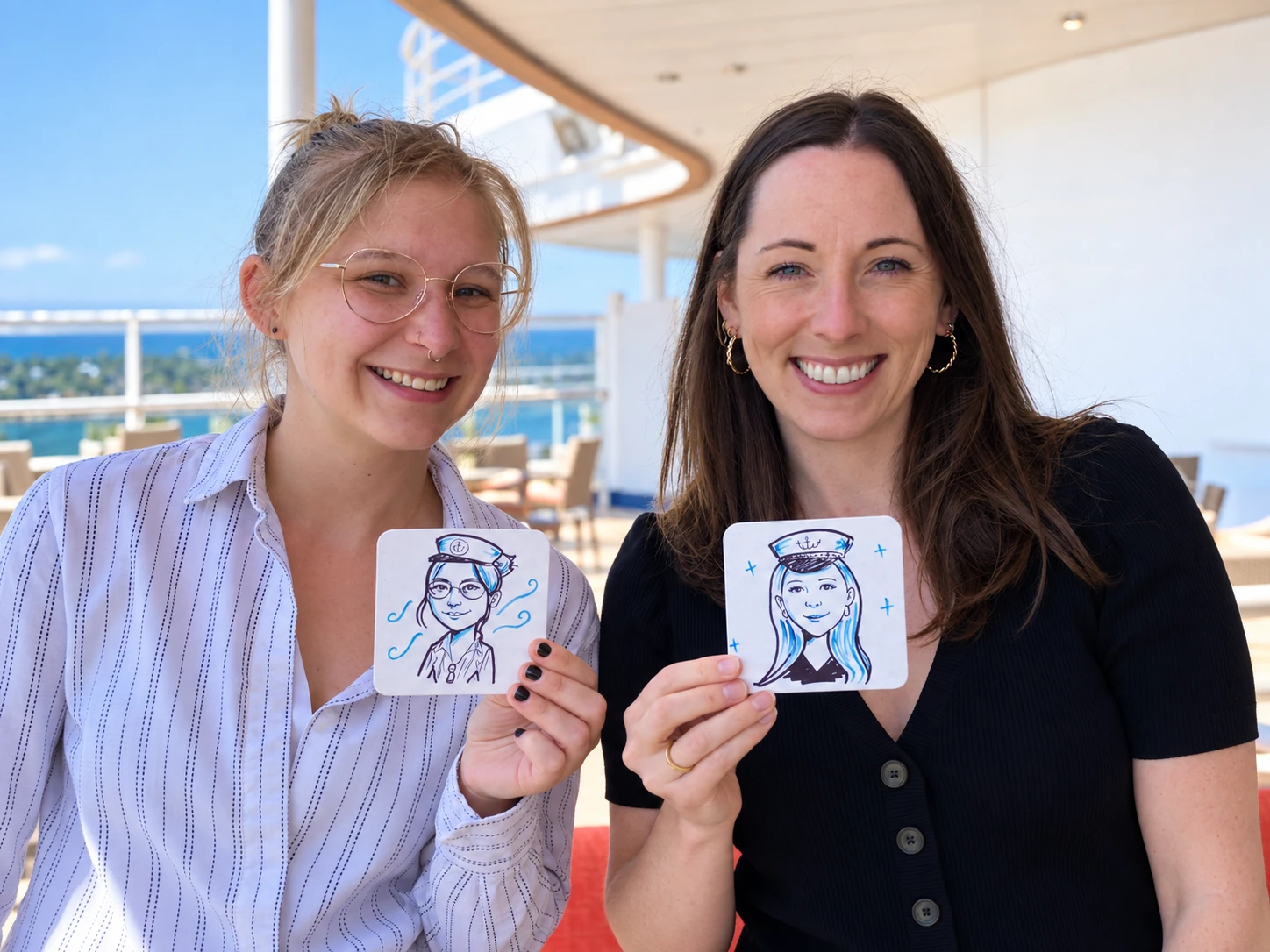 Two guests holding small square coasters with hand-drawn portraits