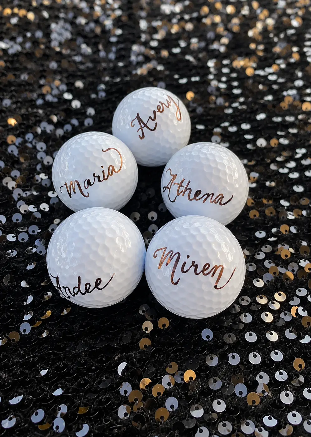 Golf balls personalized with hand-lettered names